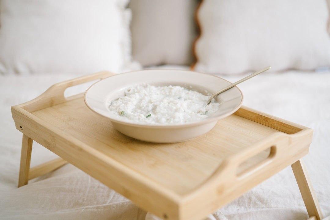 bowl of best healing postpartum porridge on a table tray