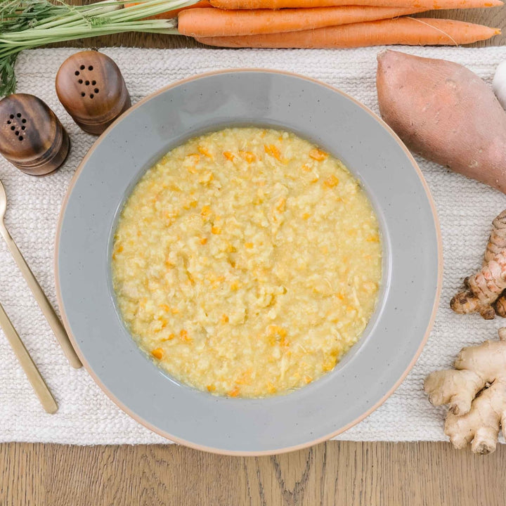 best food for postpartum a bowl of yellow chicken curry organic and regenerative and gluten-free