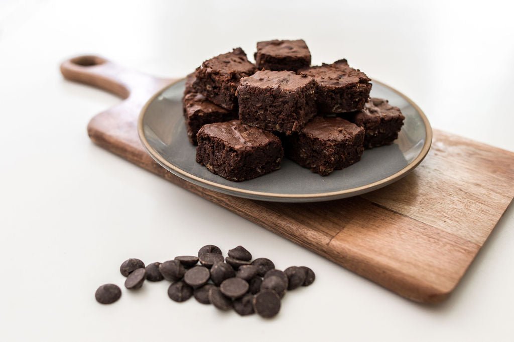Double Chocolate Lactation Brownies on a wooden table