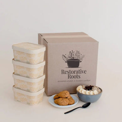 Packaging set with containers and a box labeled 'Restorative Roots' on a light background