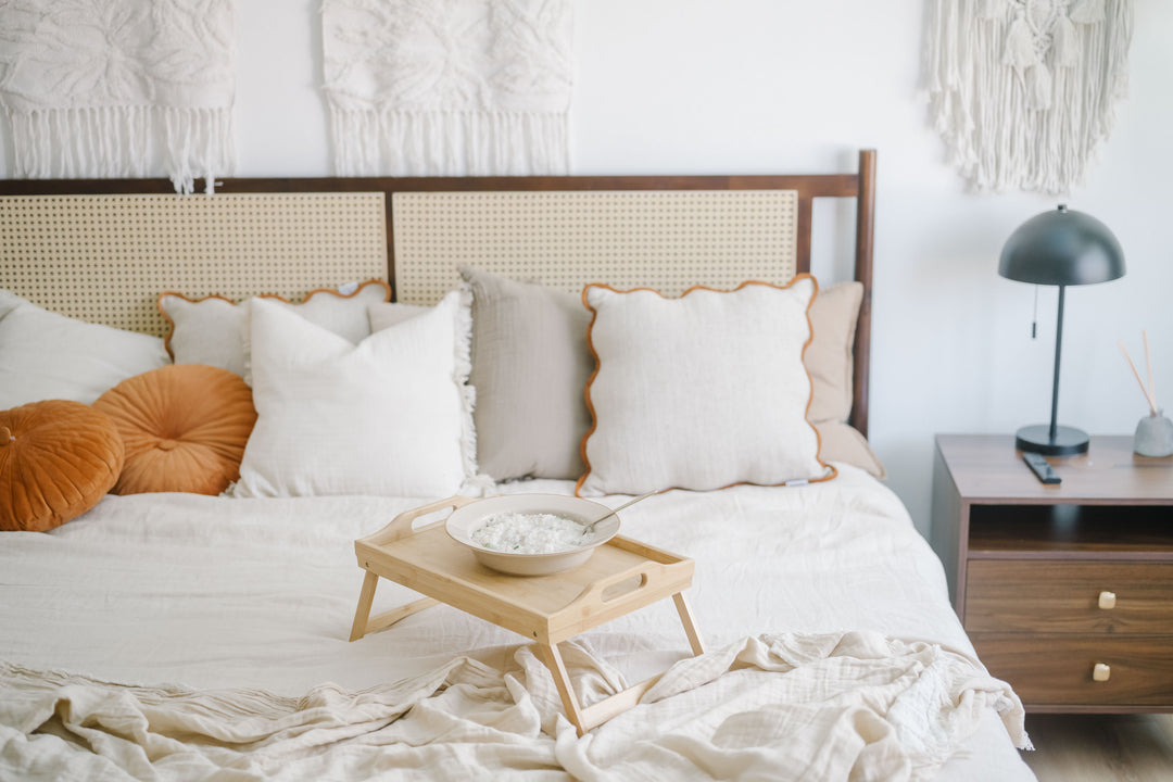 Bedroom with a breakfast tray on the bed and soft natural light