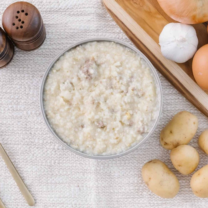 A bowl of high protein postpartum breakfast porridge on a white cloth 